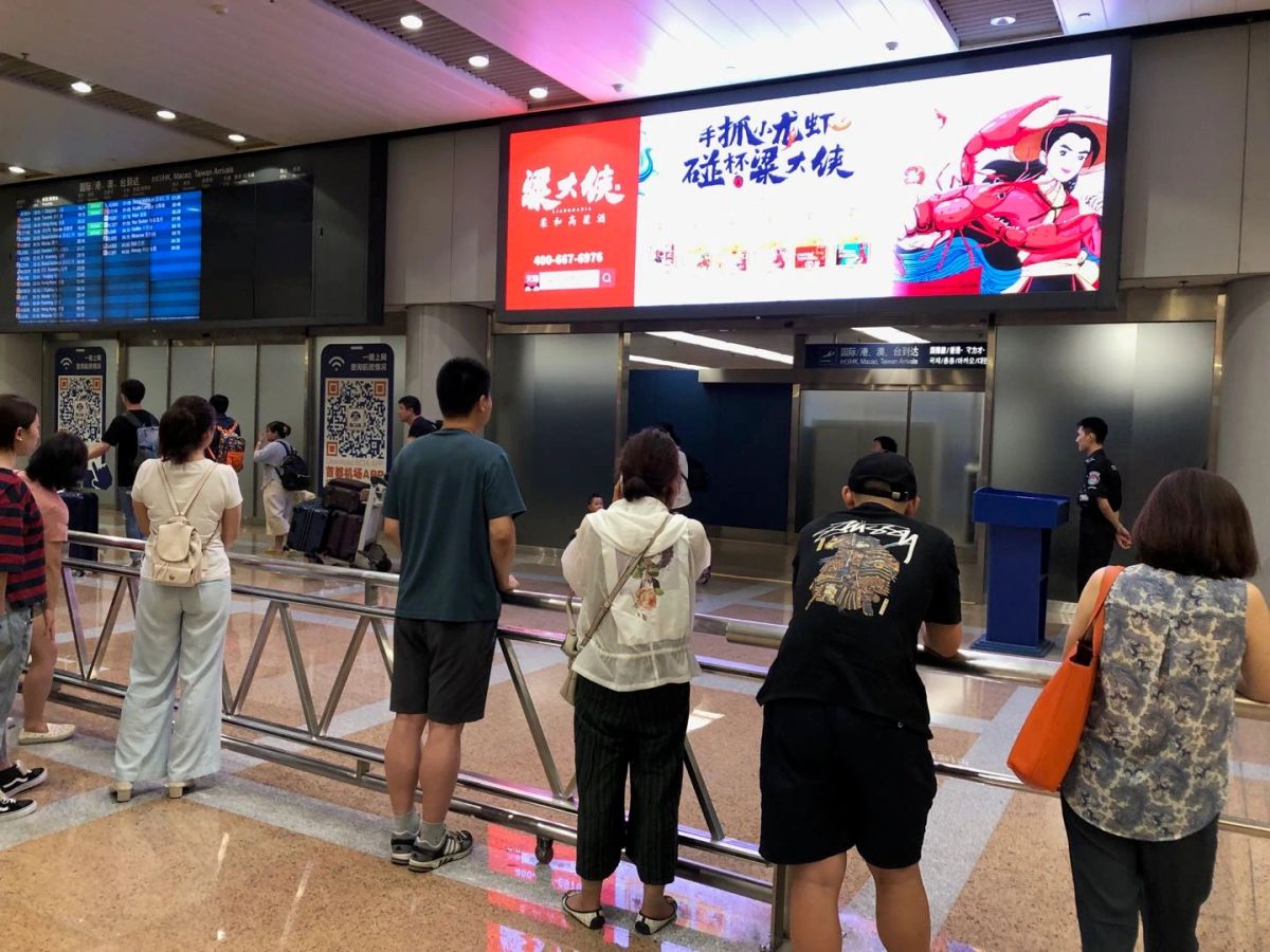Exit into the arrivals area after baggage claim.