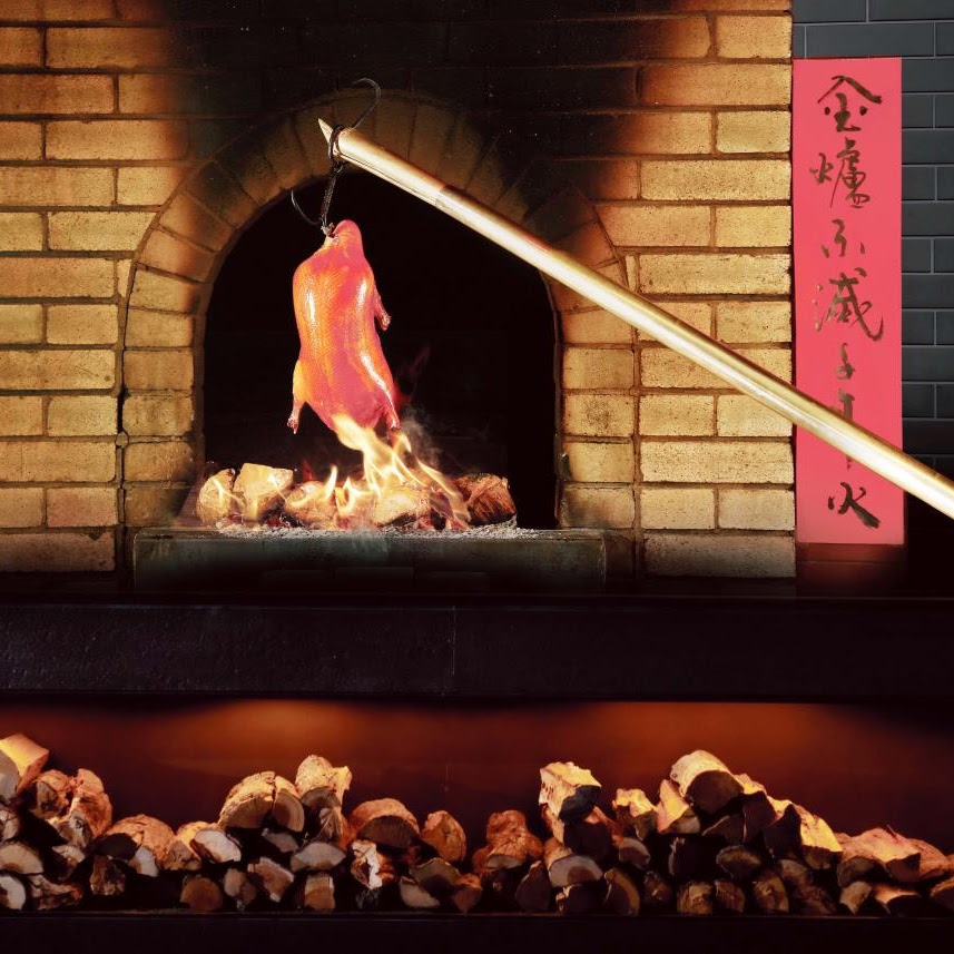 Peking duck roasting in an oven